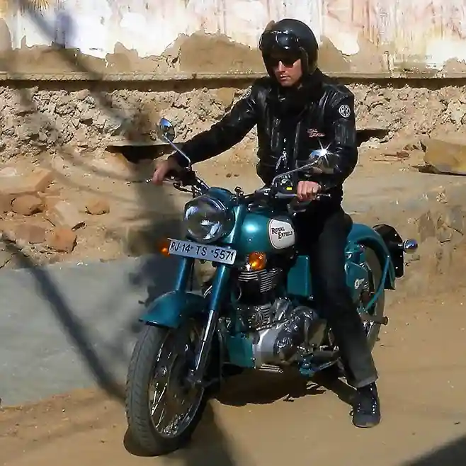 Royal Enfield Classic 350 riding through busy city streets, blending classic and modern vibes.